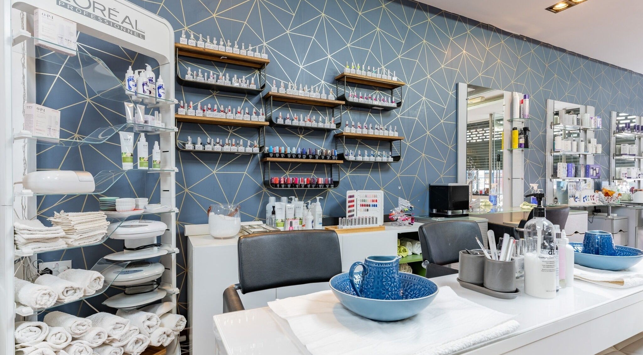 Modern beauty station at Dew Beauty and Wellness, London, England, GB, showcasing luxury products and seating.