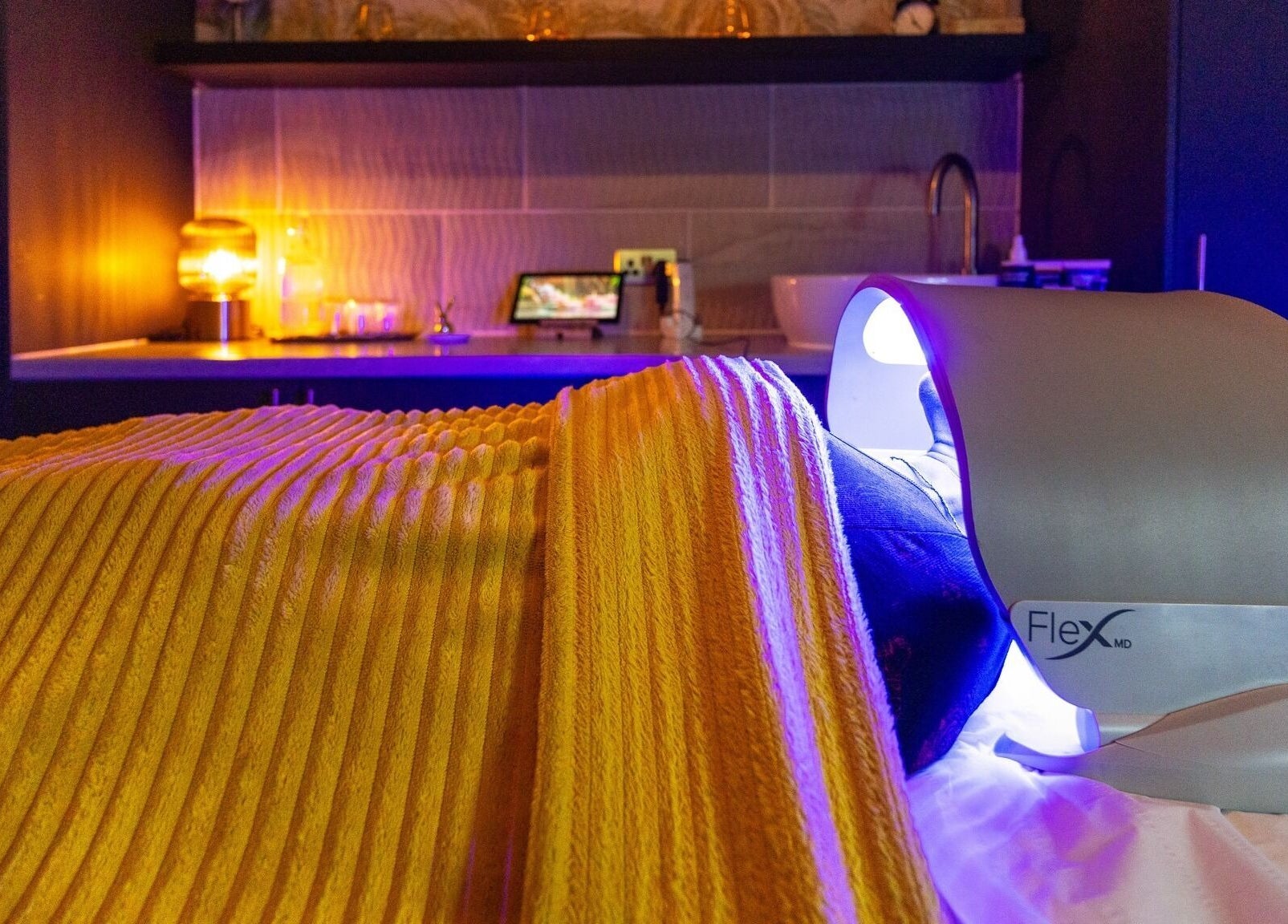 Warm therapy room with ambient lighting at Dew Beauty and Wellness, London, England, GB.