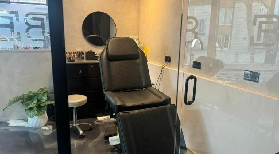 Sleek treatment room at Face Base Brighton, Brighton And Hove, England, GB with modern chair and decor.