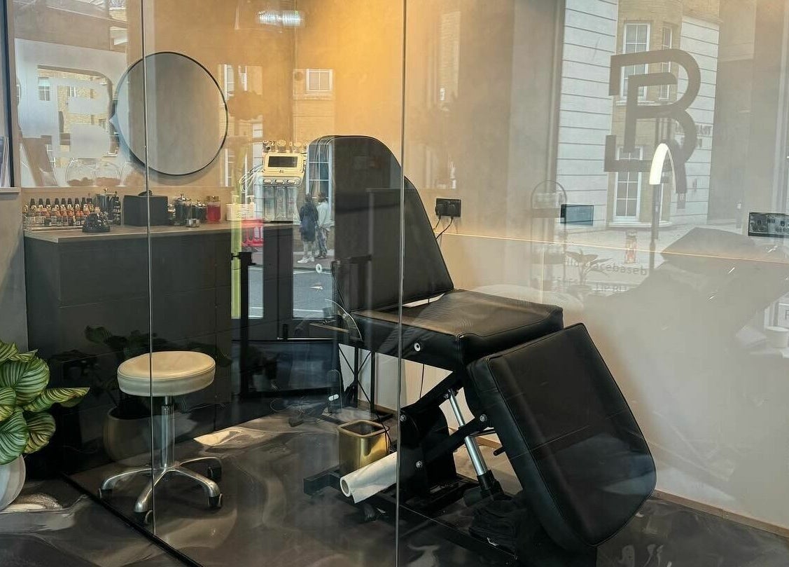 Elegant treatment room at Face Base Brighton in Brighton And Hove, England, GB with a stylish chair and decor.