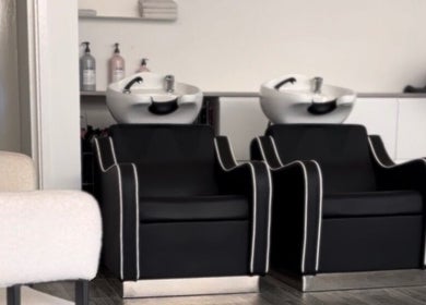 Elegant black wash stations at Hun Salon, Alton, England, GB, offering a premium hair care experience.