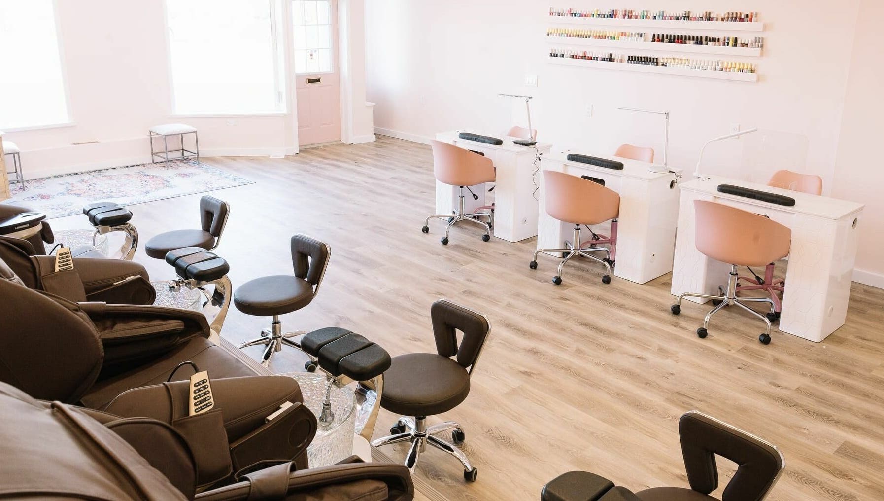 Modern salon interior at Nails & Co. Windsor in Windsor, Ontario, CA, featuring stylish chairs and nail stations.