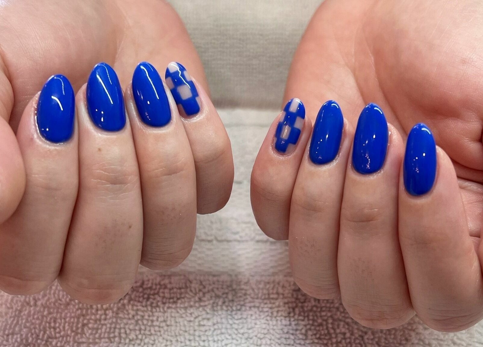 Bright blue geometric nails at Nails & Co. Windsor, located in Windsor, Ontario, CA.