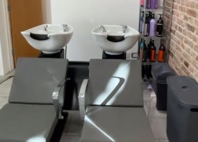 Modern wash stations at Alice Ellen Hairdressing, Portslade, England, GB displaying sleek design.