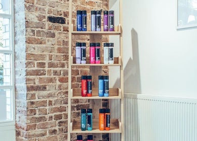 Alice Ellen Hairdressing product shelf with hair care items in Portslade, England, GB.