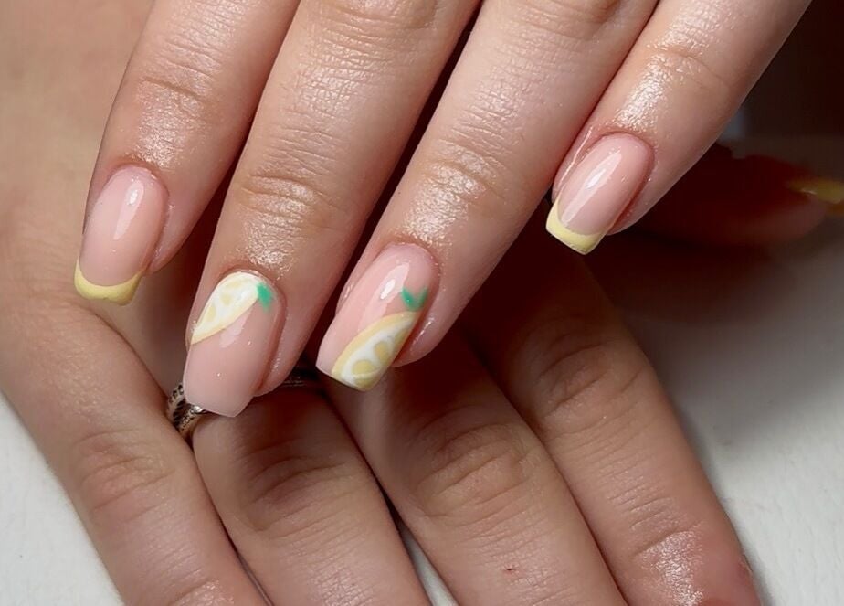 Lemon-themed nail art at The Mani Lounge Cheshire, Congleton, England, GB, showcasing distinctive citrus design.