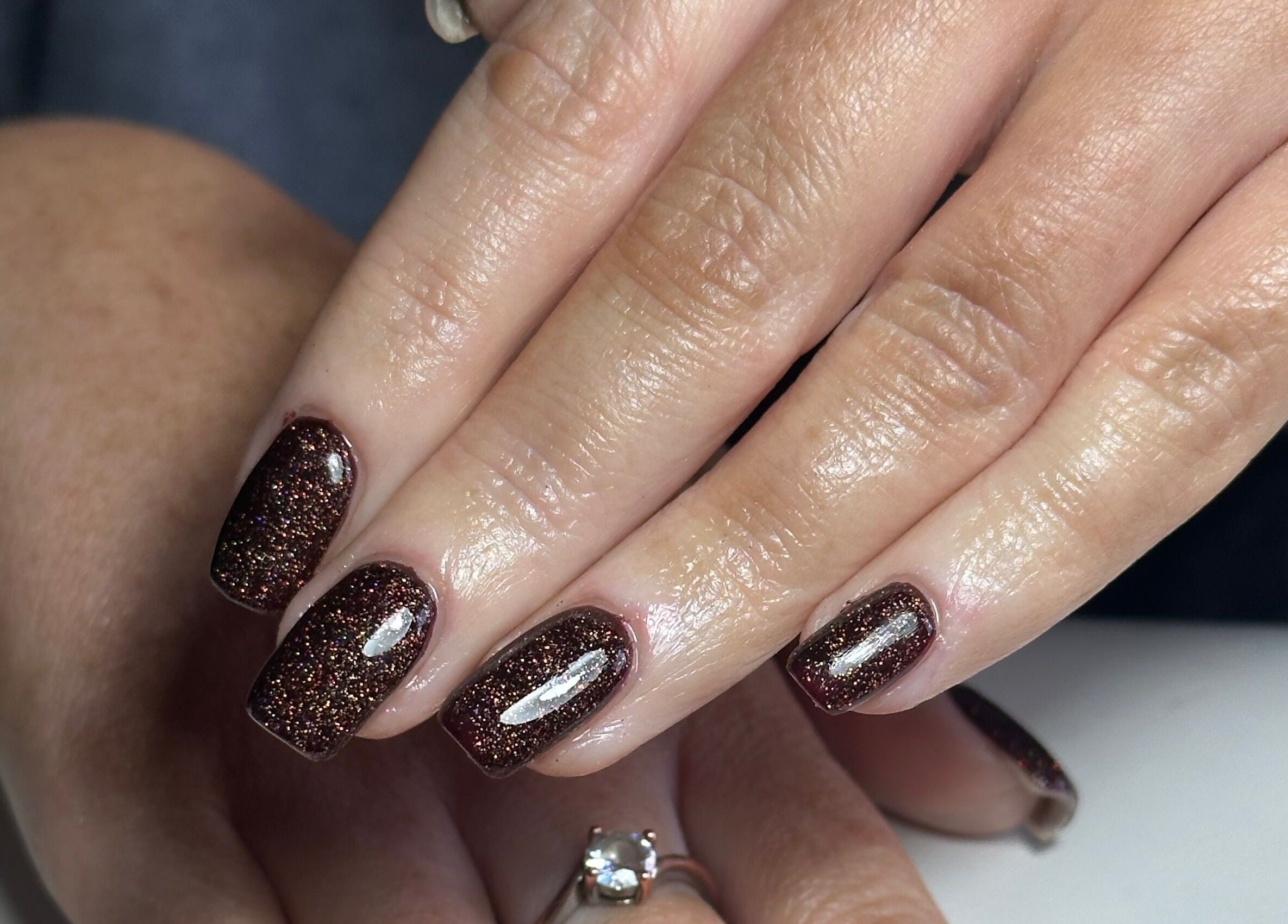 Stylish glitter nails at The Mani Lounge Cheshire, Congleton, England, GB, showcasing expert nail artistry.