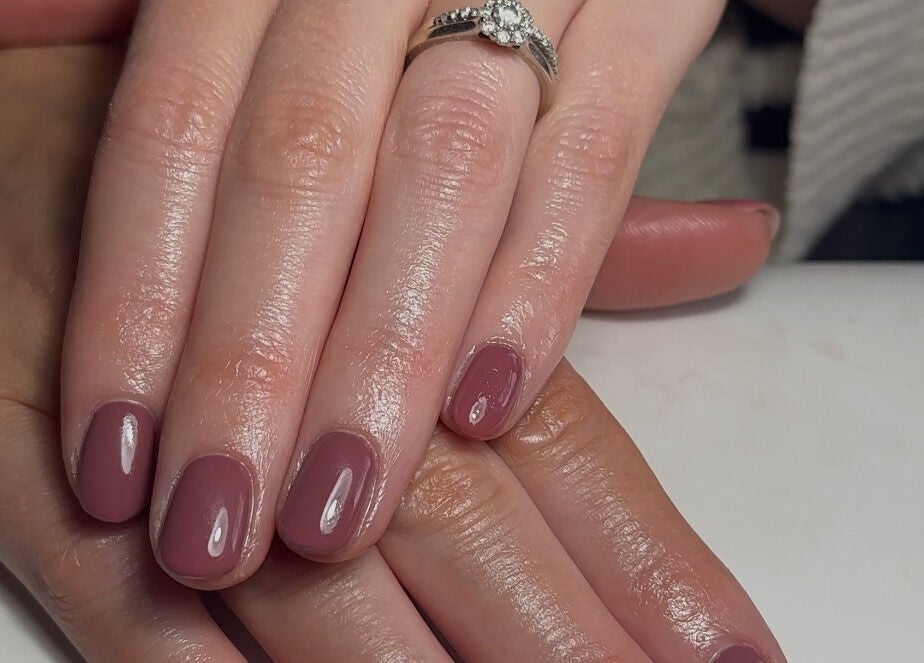 Glossy manicure at The Mani Lounge Cheshire, Congleton, England, GB showcasing elegant nail art.