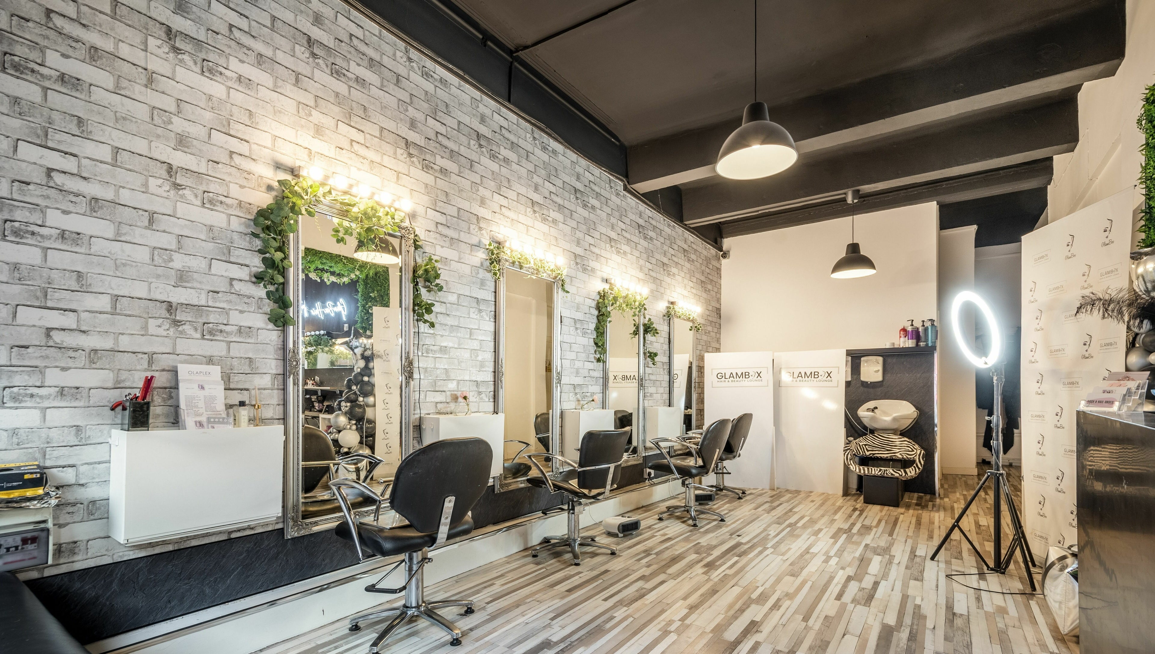 Elegant interior of SALON 921 in Glasgow, Scotland, GB, showcasing stylish chairs and mirrors.