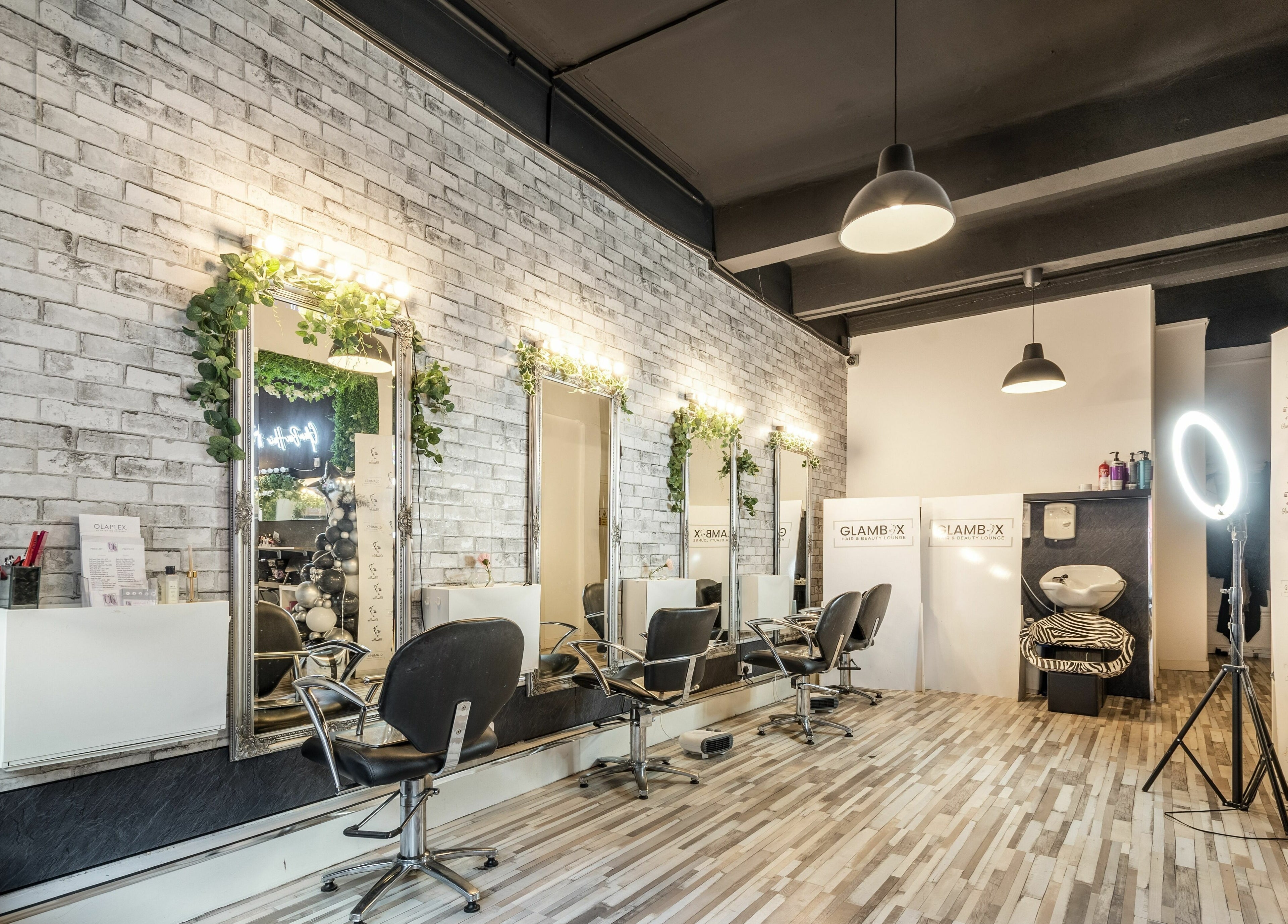 Elegant interior of SALON 921 in Glasgow, Scotland, GB, showcasing stylish chairs and mirrors.