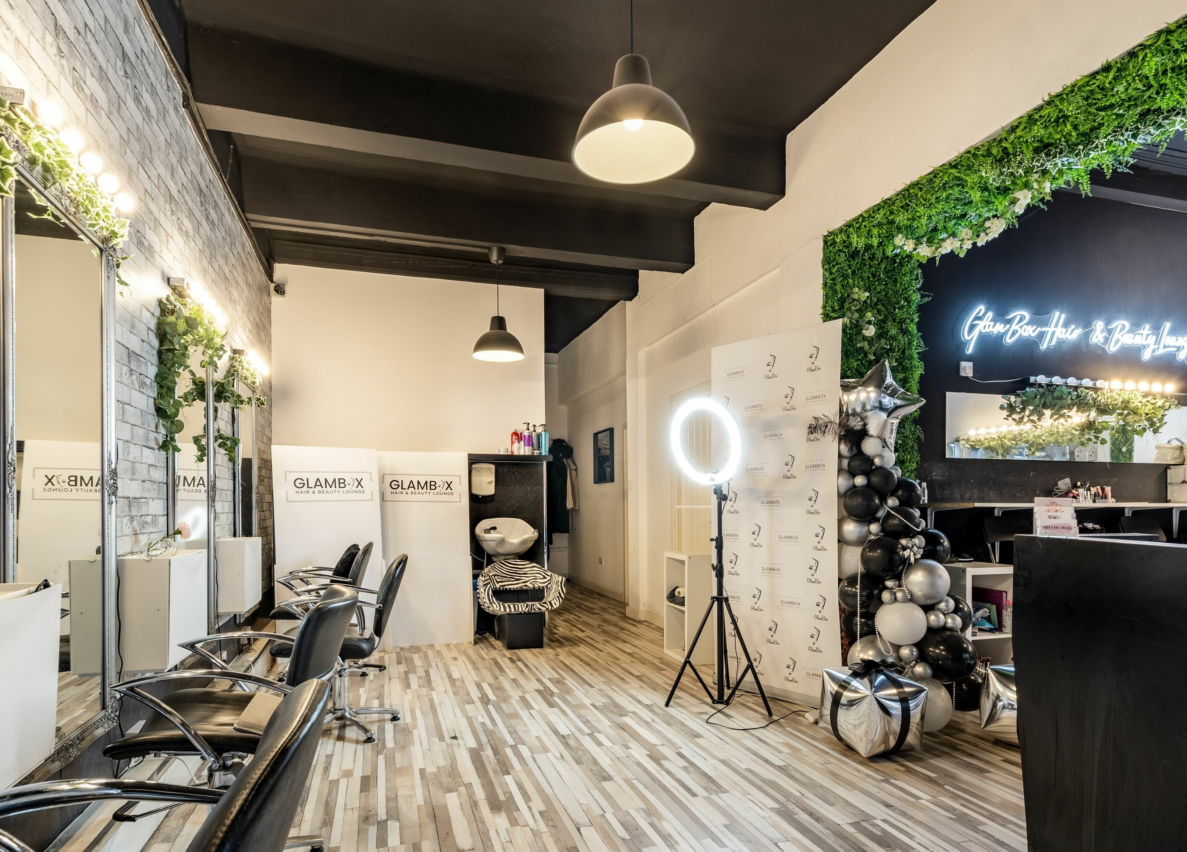 Modern salon interior at SALON 921, Glasgow, Scotland, GB with stylish decor and salon chairs.