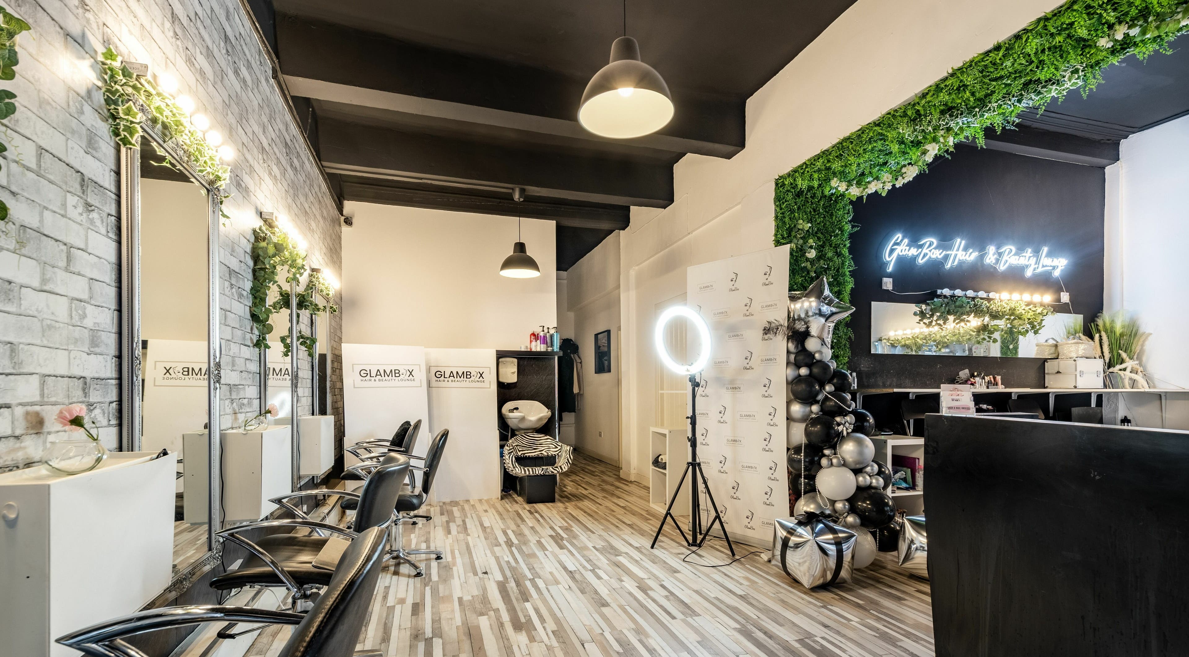 Modern salon interior at SALON 921, Glasgow, Scotland, GB with stylish decor and salon chairs.
