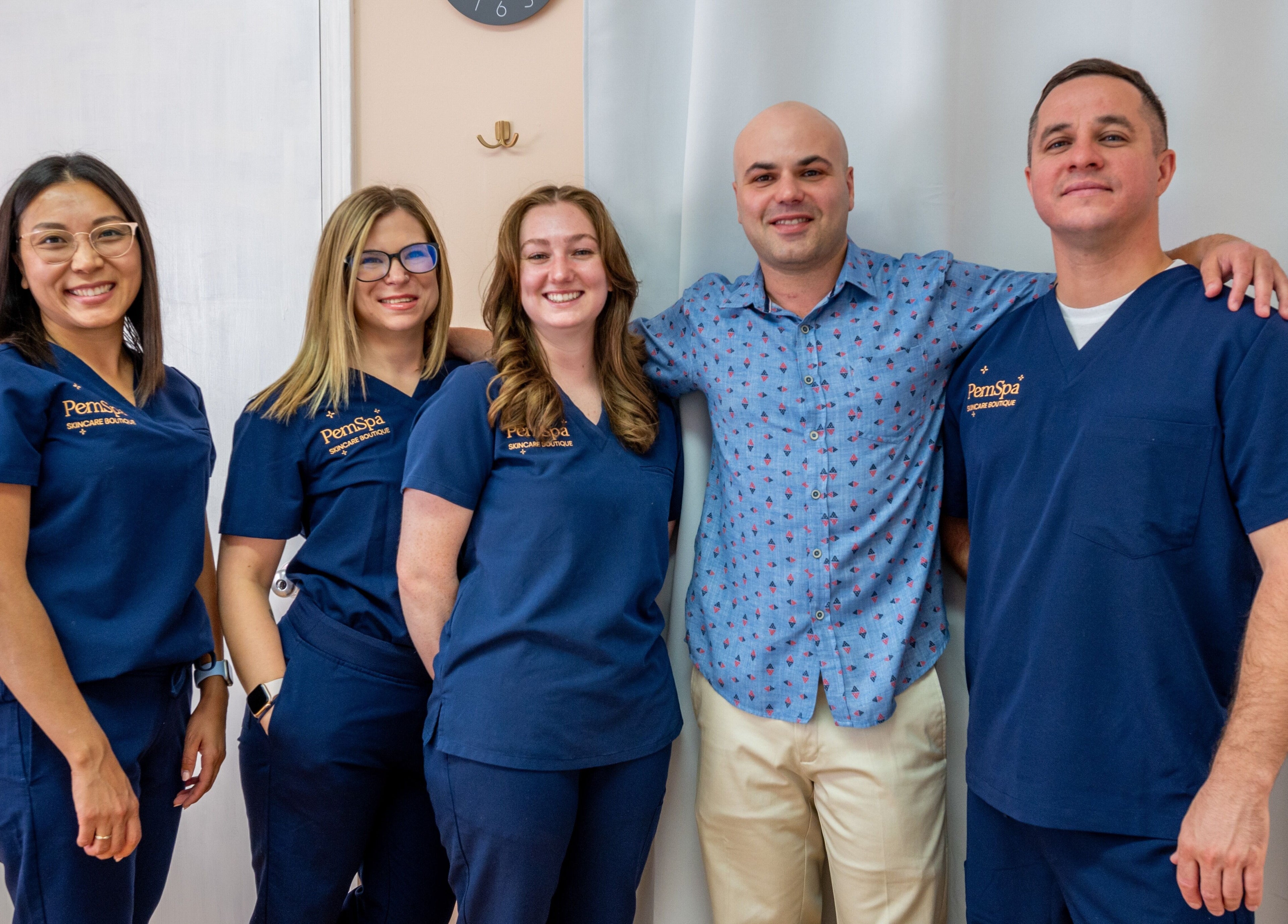 PemSpa team smiling together at Newton, Massachusetts, US, showcasing a welcoming wellness ambiance.