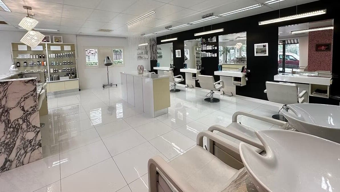 The Edge Hill Hairdressers in Edge Hill, Queensland, AU. A chic interior with stylish mirrors and chairs.