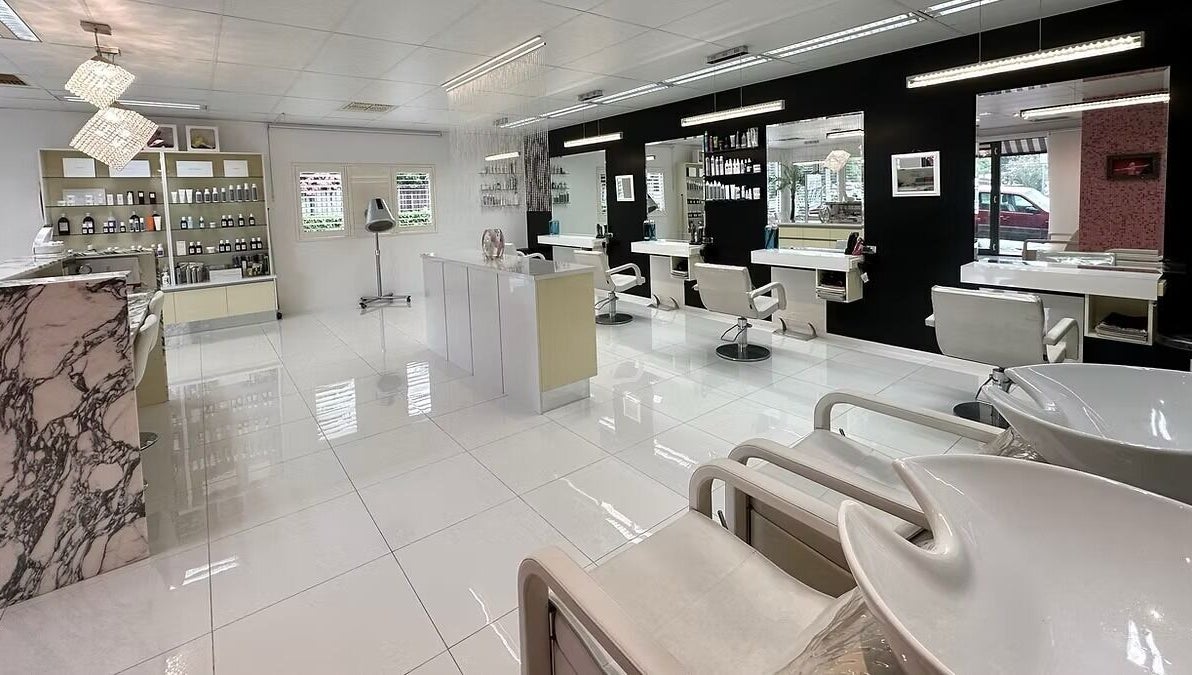 The Edge Hill Hairdressers in Edge Hill, Queensland, AU. A chic interior with stylish mirrors and chairs.