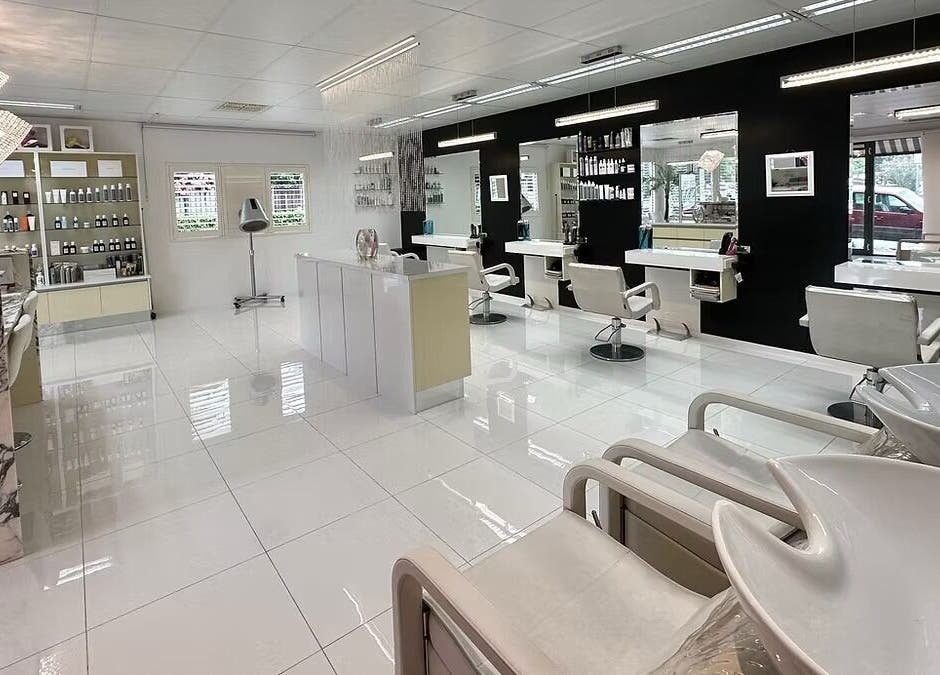 The Edge Hill Hairdressers in Edge Hill, Queensland, AU. A chic interior with stylish mirrors and chairs.