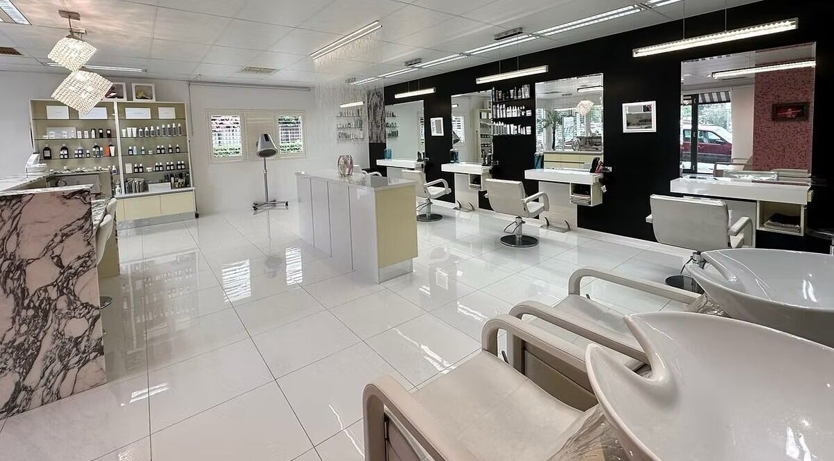 The Edge Hill Hairdressers in Edge Hill, Queensland, AU. A chic interior with stylish mirrors and chairs.