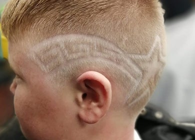 Stylish buzzcut design at Leigh the Barber in Barrow in Furness, England, GB, showcasing artistic flair.