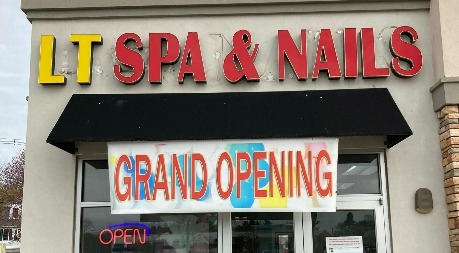 LT Spa & Nails grand opening banner at Wilmington, Massachusetts, US entrance.