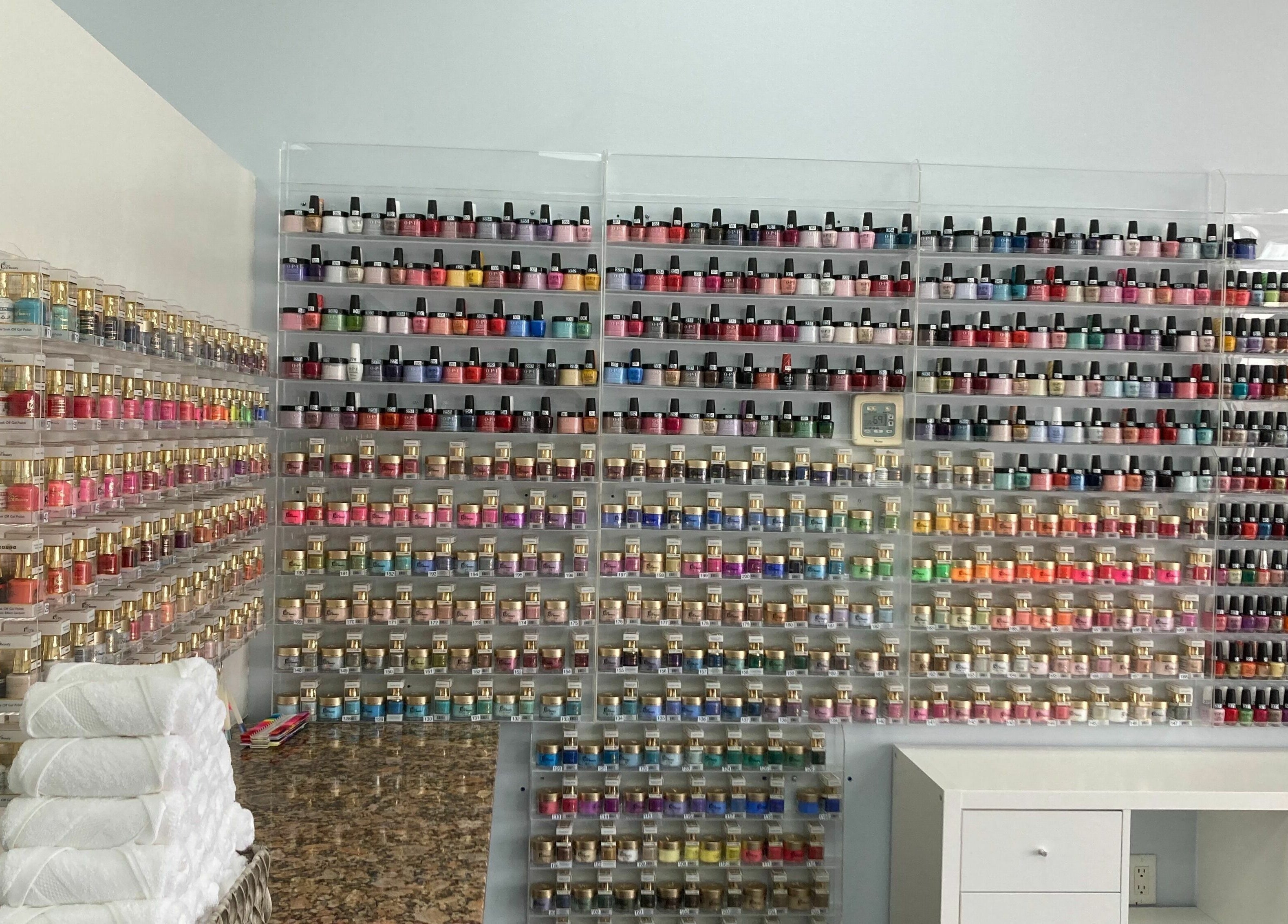 Vibrant nail polish display at LT Spa & Nails, Wilmington, Massachusetts, US showcasing diverse colors.