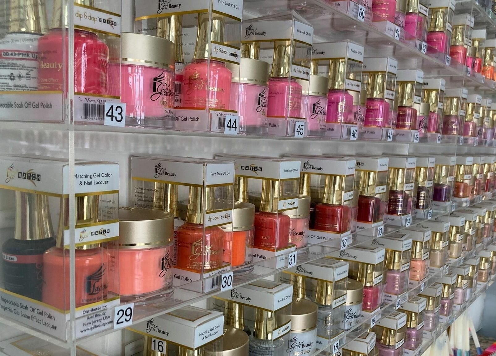 Colorful nail polish collection at LT Spa & Nails in Wilmington, Massachusetts, US.