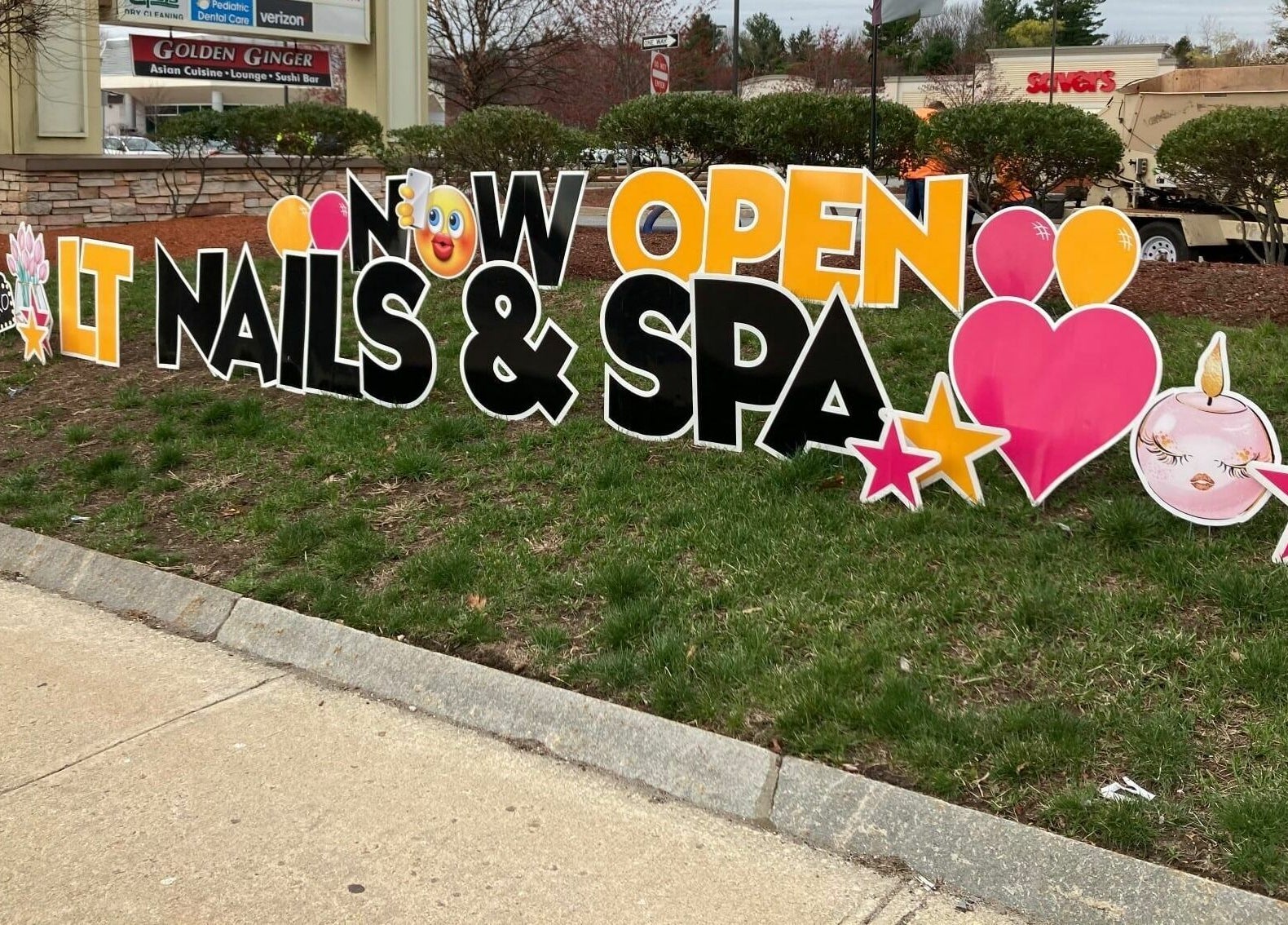 Vibrant sign at LT Spa & Nails, Wilmington, Massachusetts, US, showcasing grand opening.
