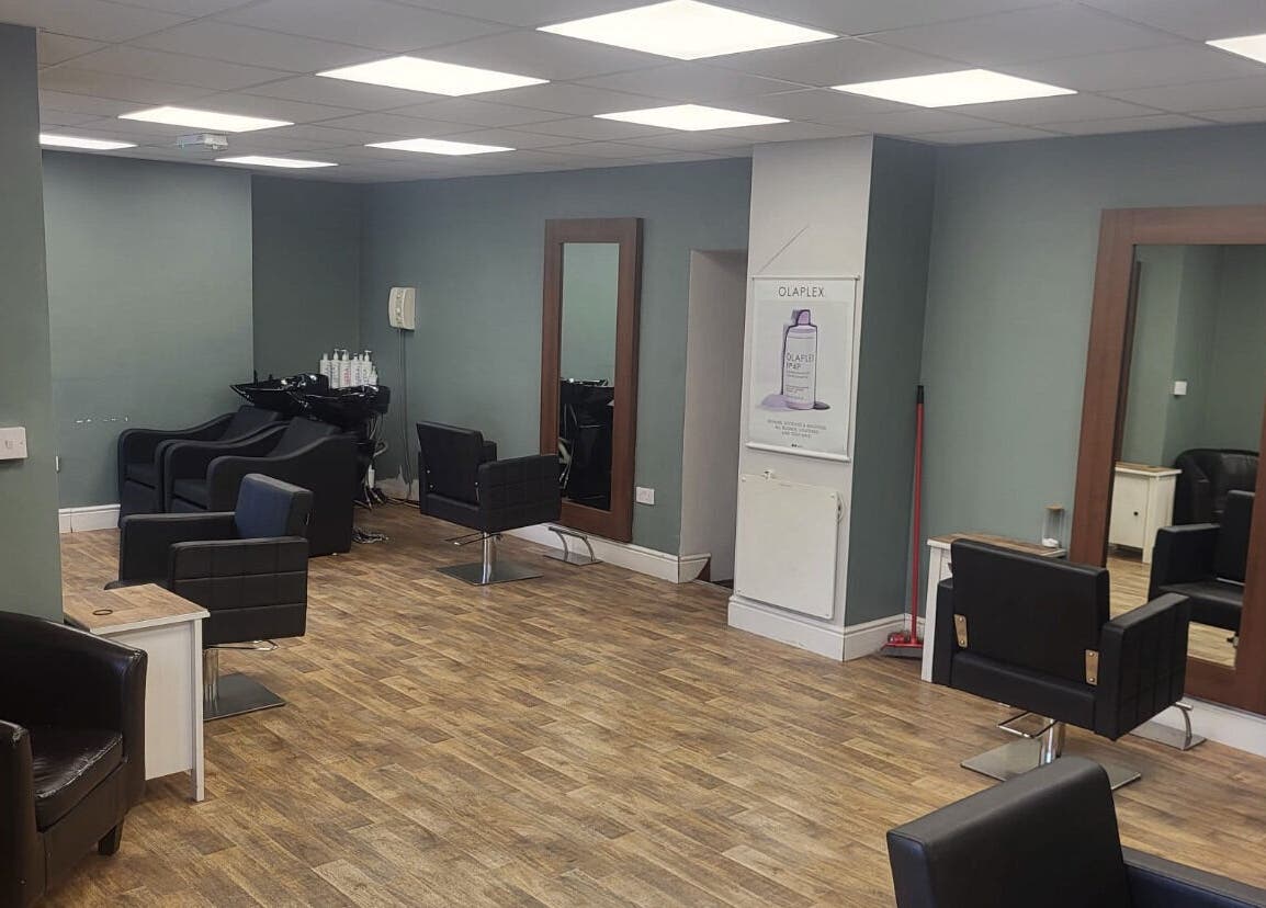 Modern salon interior at Cutting Edge Hair Studio Edenderry, County Offaly, IE, showcasing stylish mirrors and chairs.