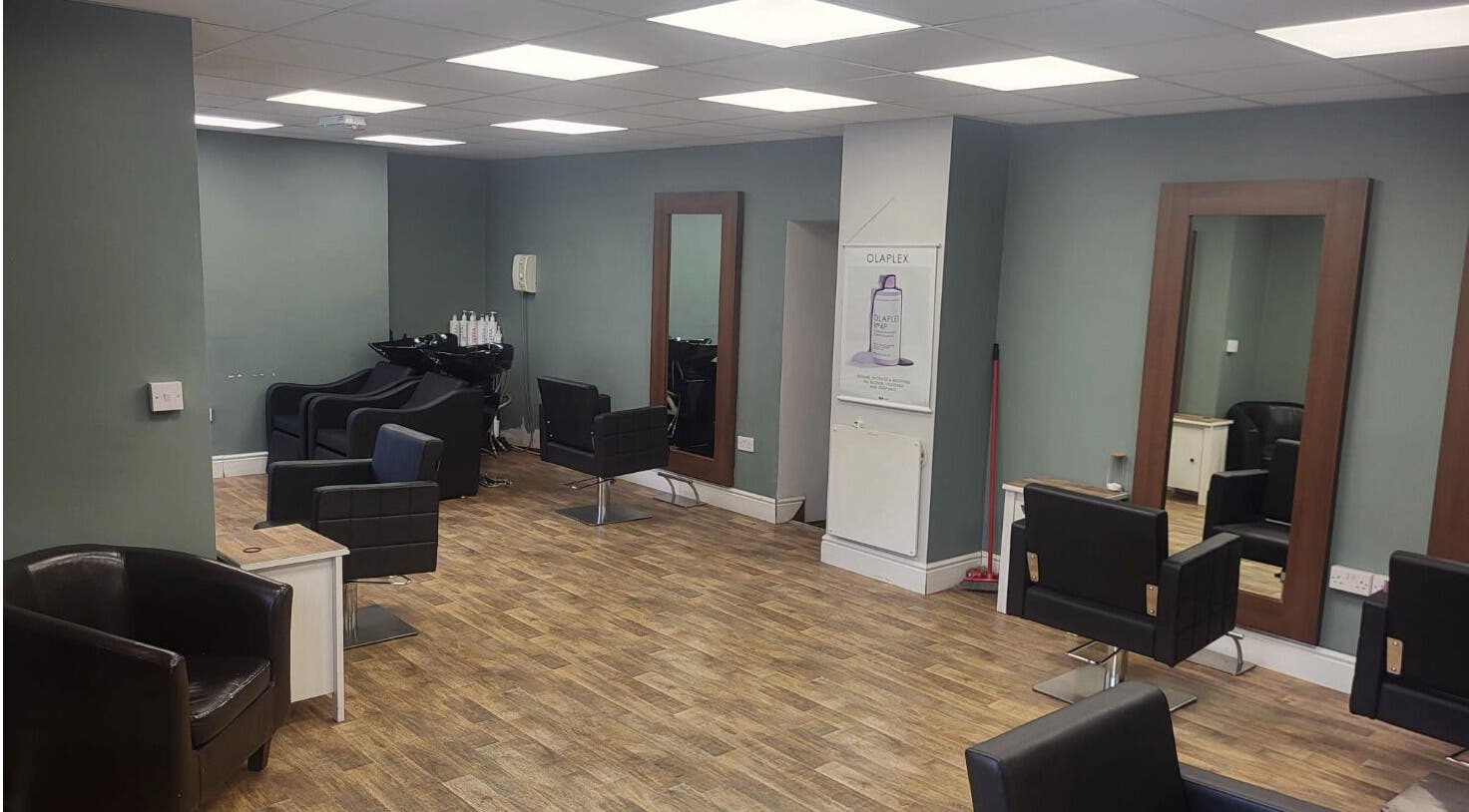 Modern salon interior at Cutting Edge Hair Studio Edenderry, County Offaly, IE, showcasing stylish mirrors and chairs.