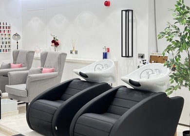 Relaxing interior of Sulit Hair and Spa - Bausher in Muscat, Muscat Governorate, OM with modern salon chairs.