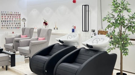 Relaxing interior of Sulit Hair and Spa - Bausher in Muscat, Muscat Governorate, OM with modern salon chairs.