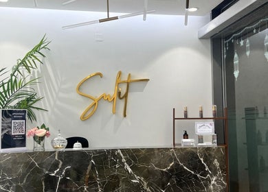 The reception area of Sulit Hair and Spa - Bausher, Muscat, Muscat Governorate, OM, featuring a sleek design.
