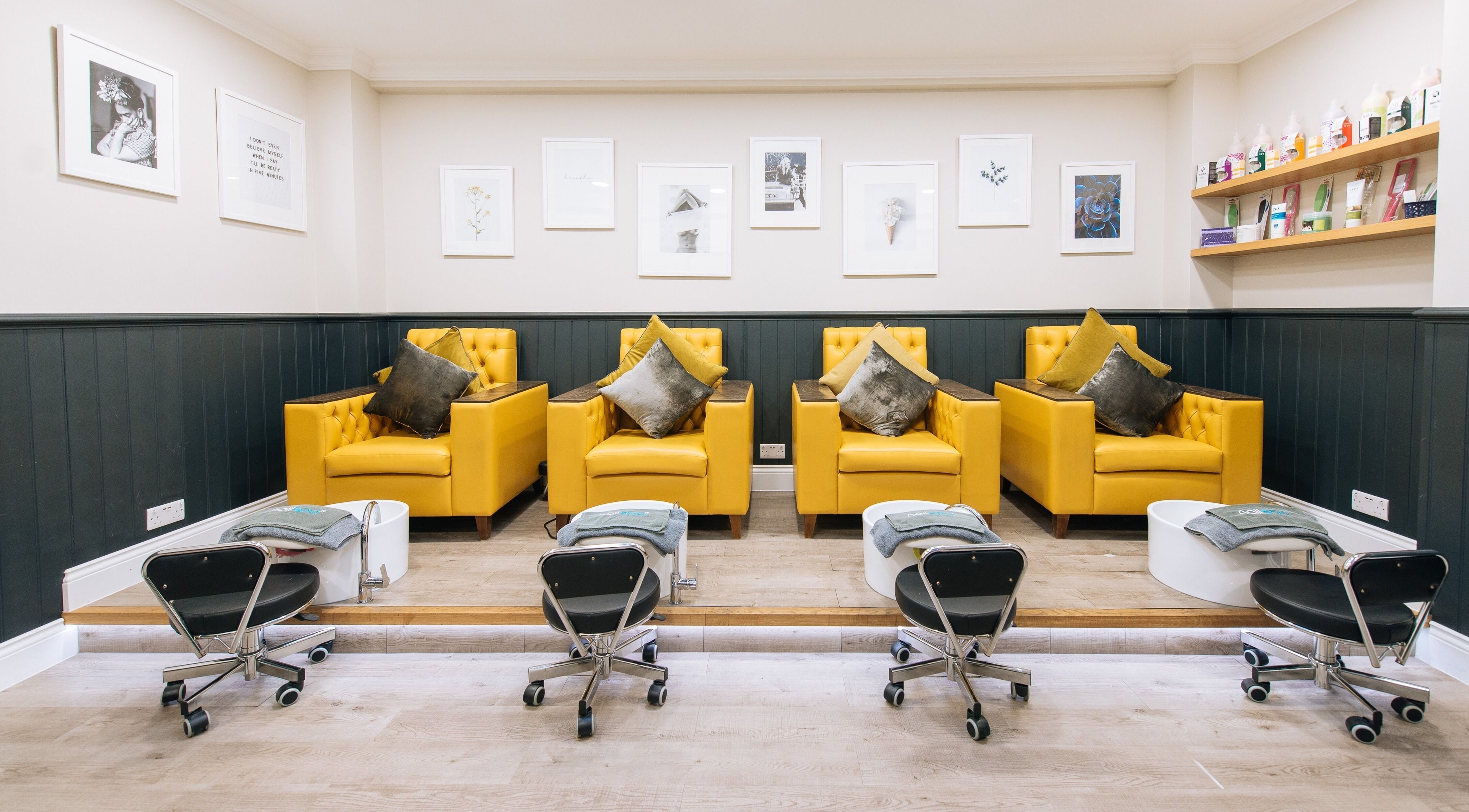 Elegant nail spa seating area at Nail Spa - Original in London, England, GB with plush yellow chairs.