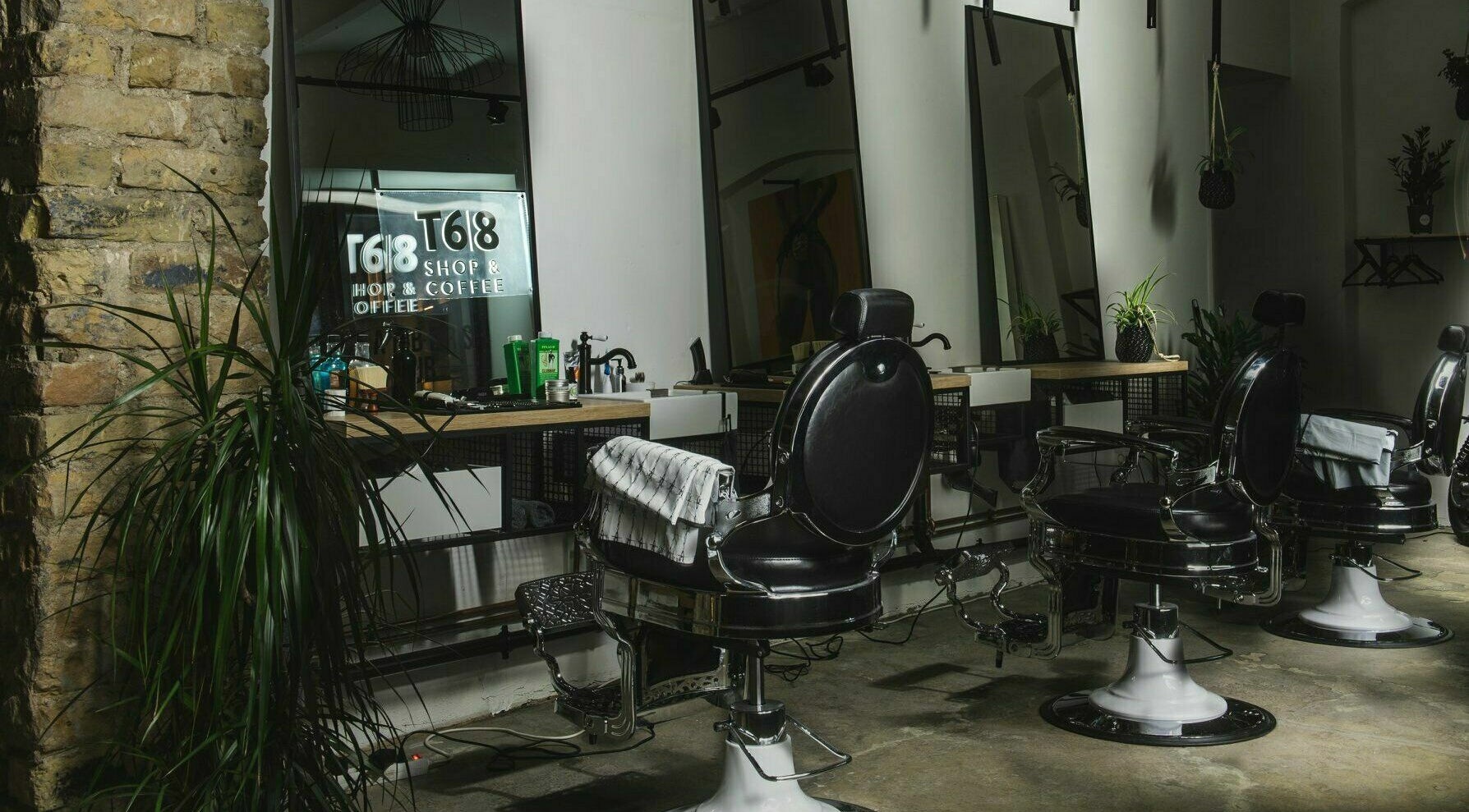 Elegant barber chairs at Barbers HUB, Elizabetes 75, Rīga, LV, showcasing cozy and stylish interior.