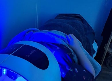 Relaxing LED light therapy session at Skin Revision, Douglas, IM, enhancing skin health and wellness.