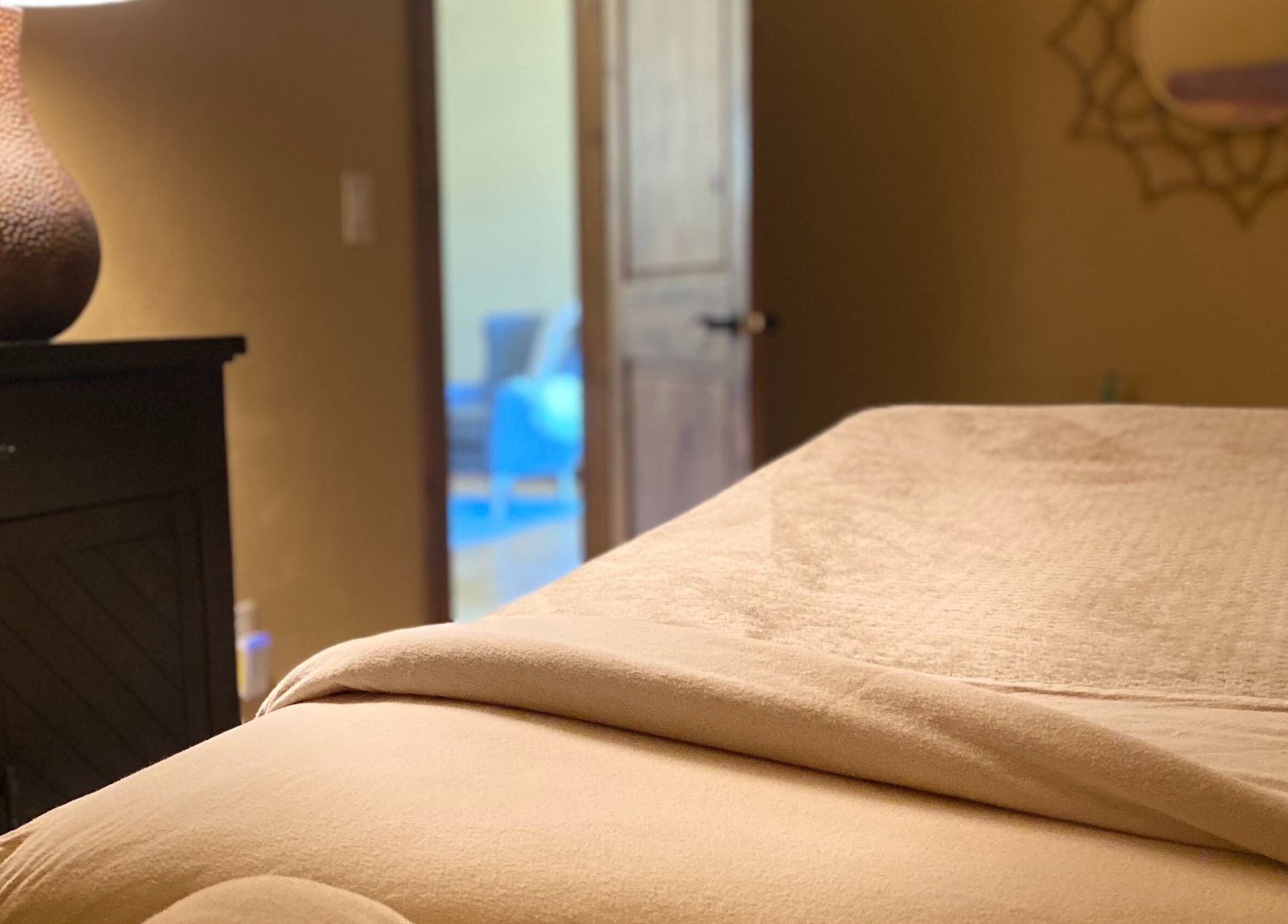 Cozy massage room at Massage Therapy Studio, Great Falls, Montana, US, featuring a neatly prepared massage table.