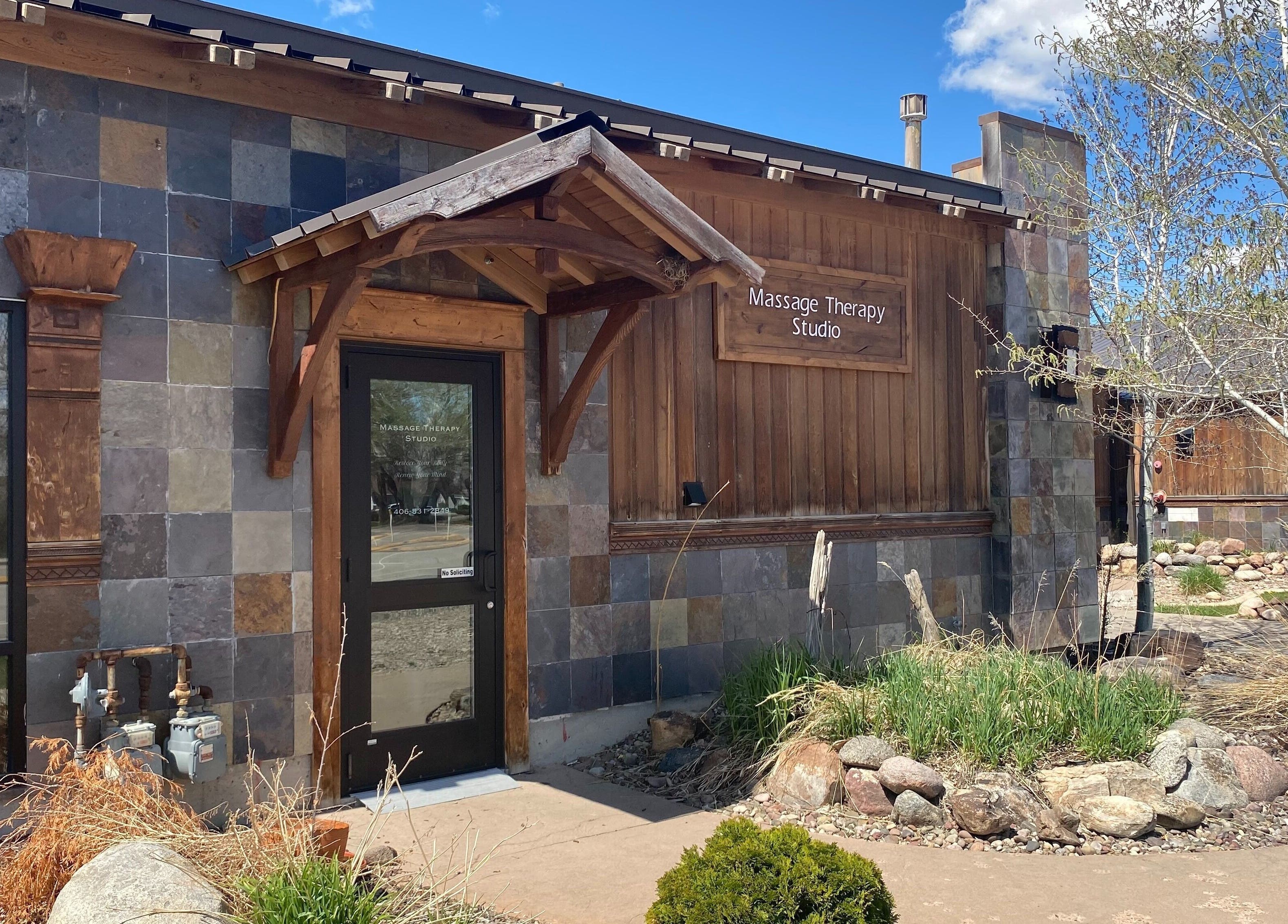 Entrance of Massage Therapy Studio in Great Falls, Montana, US with rustic architecture.