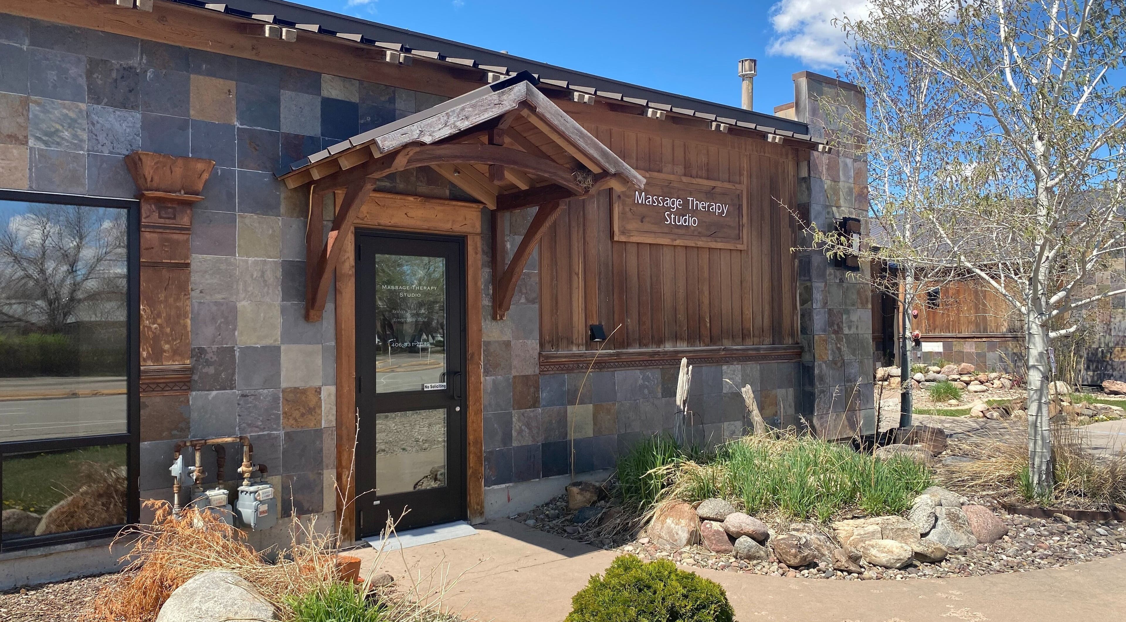 Entrance of Massage Therapy Studio in Great Falls, Montana, US with rustic architecture.