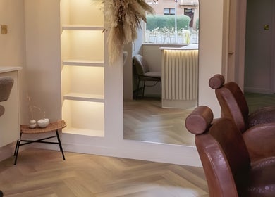 Lux - Clarkston salon interior in Glasgow, Scotland, GB, showcasing stylish chairs and modern decor.