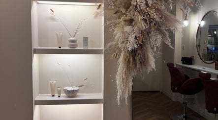 Lux - Cathcart's elegant shelf display with beauty products and floral decor in Glasgow, Scotland, GB.