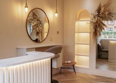 Lux - Cathcart's elegant reception in Glasgow, Scotland, GB features a chic mirror and warm minimalist decor.