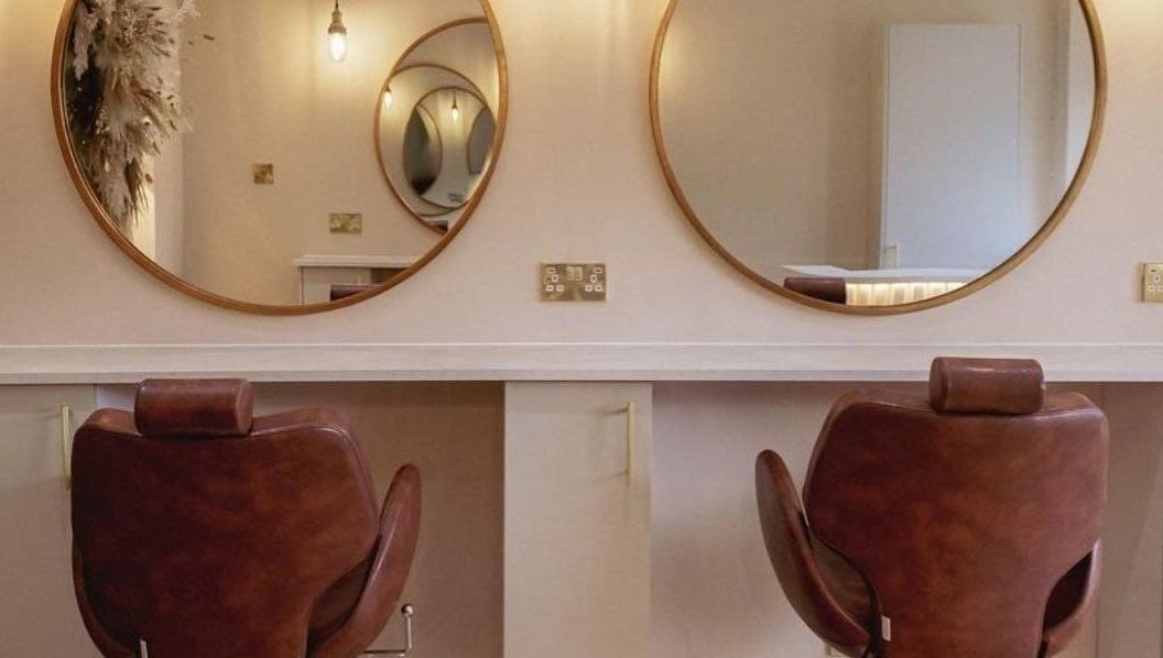 Elegant salon chairs and mirrors at LUX, Glasgow, Scotland, GB, ideal for beauty treatments.