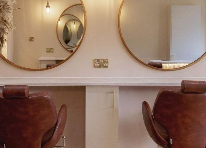 Elegant salon chairs and mirrors at LUX, Glasgow, Scotland, GB, ideal for beauty treatments.