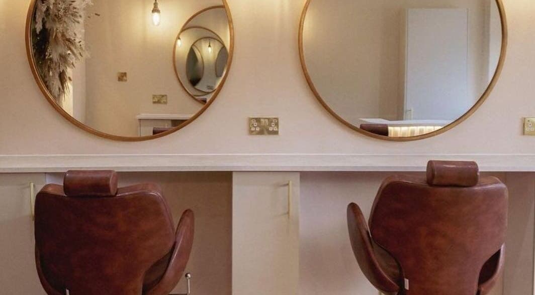 Elegant salon chairs and mirrors at LUX, Glasgow, Scotland, GB, ideal for beauty treatments.