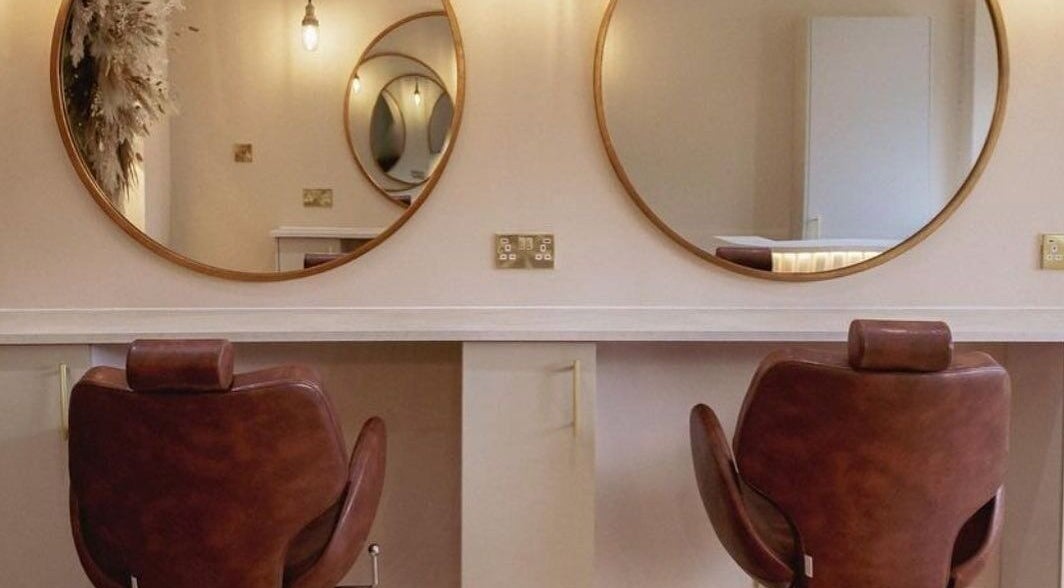 Elegant salon chairs and mirrors at LUX, Glasgow, Scotland, GB, ideal for beauty treatments.