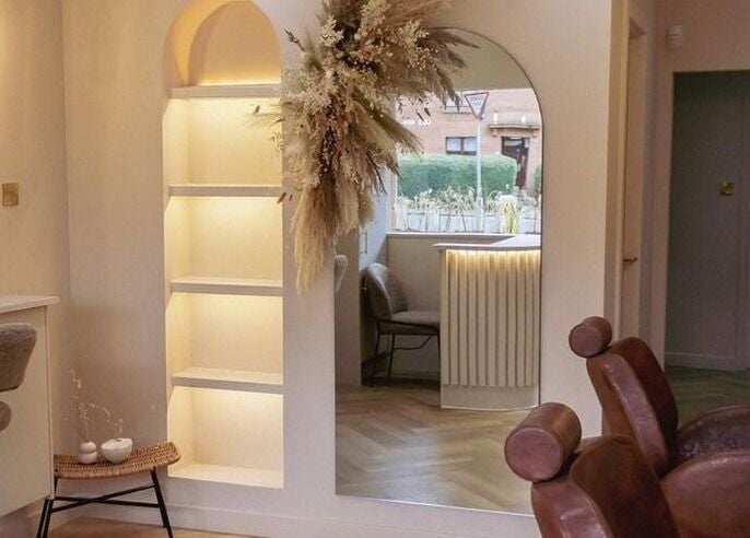 Elegant interior of LUX salon in Glasgow, Scotland, GB with stylish chairs and decor.