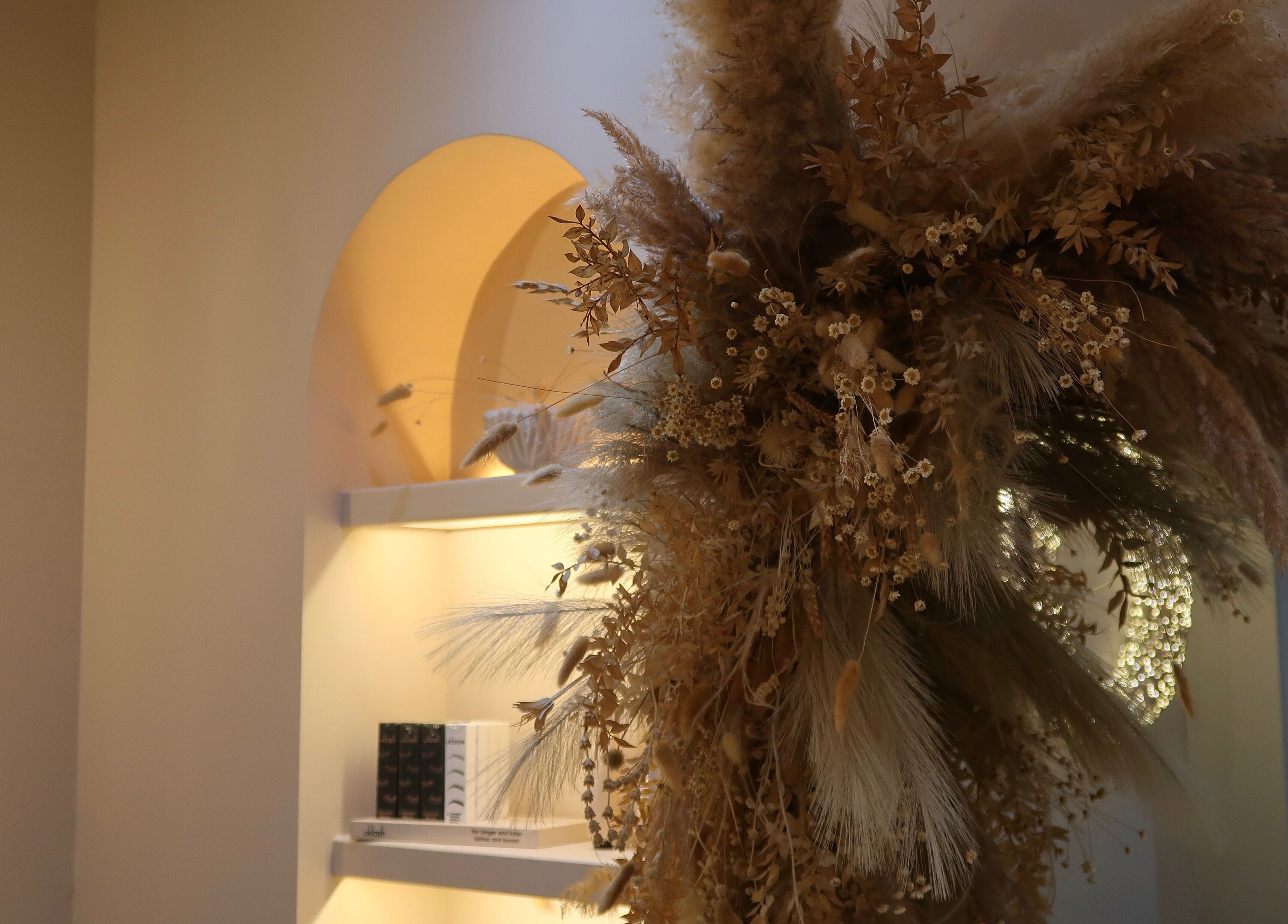 Elegant dried floral arrangement at LUX, Glasgow, Scotland, GB enhances the tranquil ambiance.