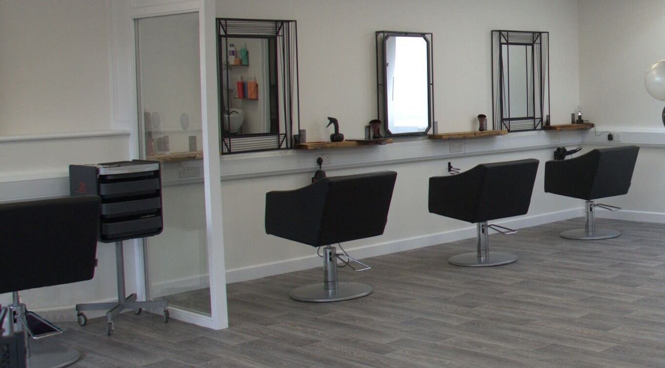 Modern styling chairs at Deevers Hair Salon in Faringdon, GB, showcasing sleek design and comfort.