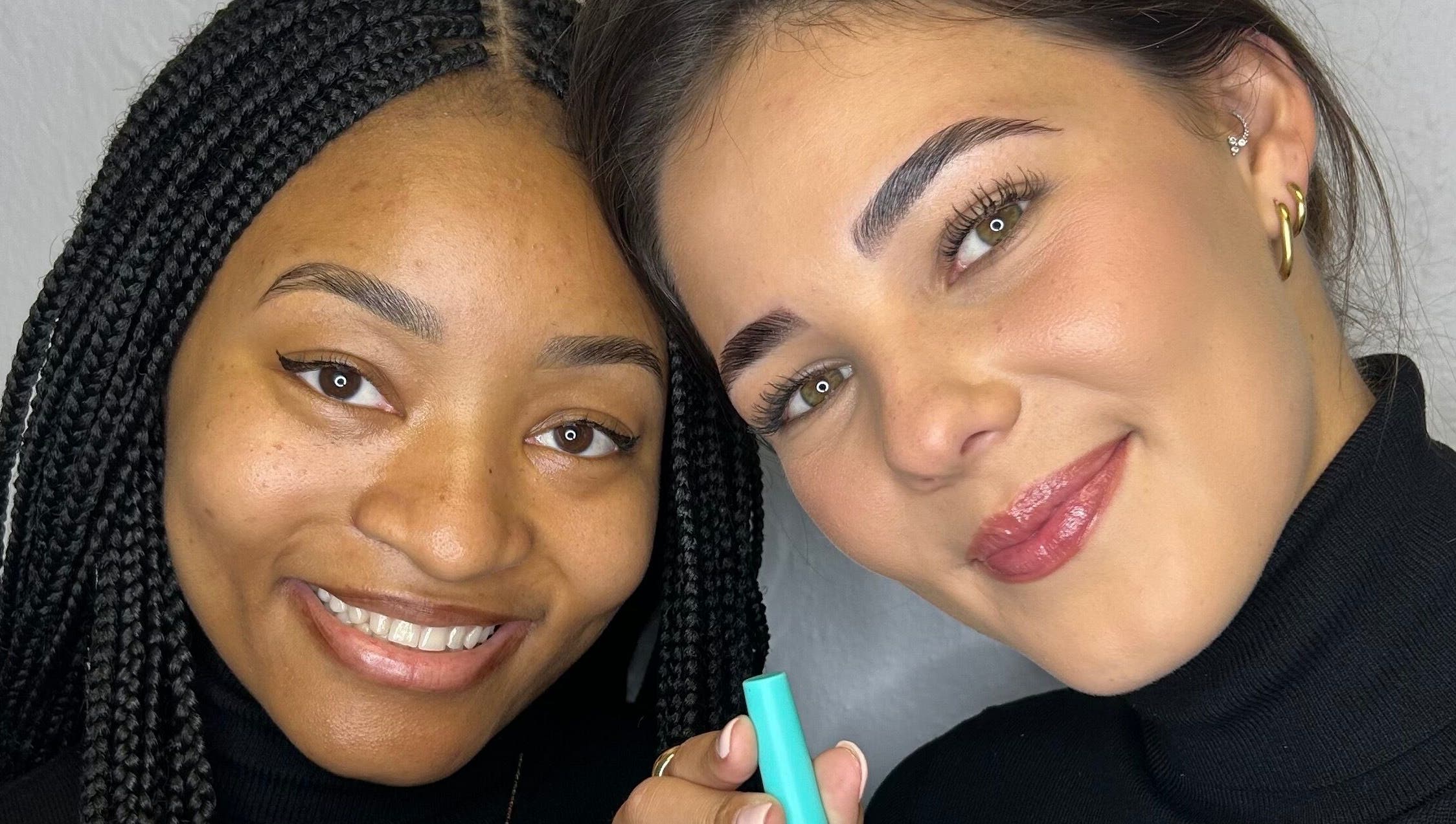 Two smiling clients with flawless makeup at Totally Glam - Fourways, Sandton, Gauteng, ZA.