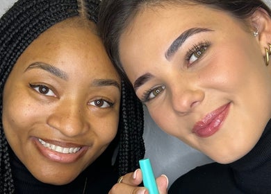 Two smiling clients with flawless makeup at Totally Glam - Fourways, Sandton, Gauteng, ZA.