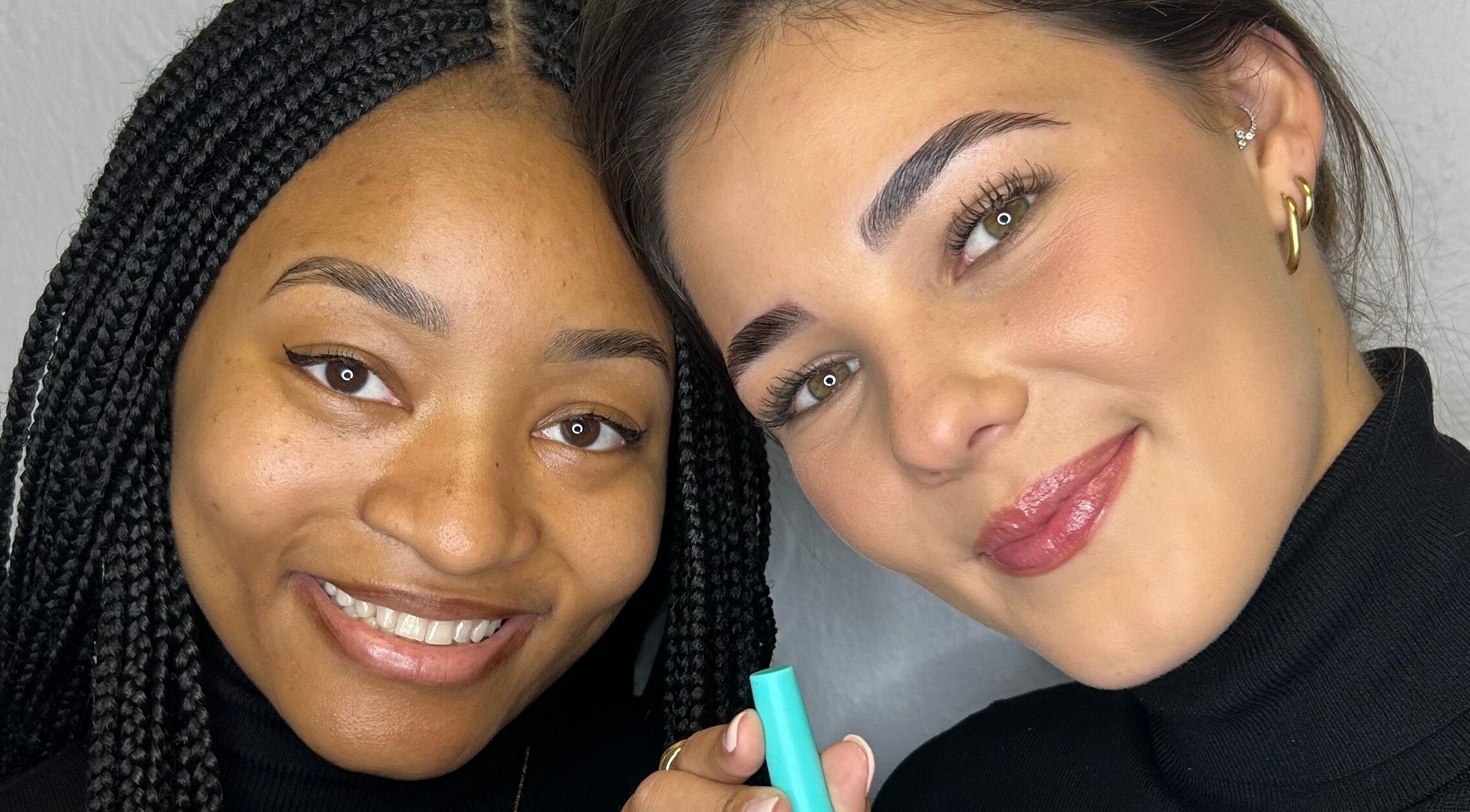 Two smiling clients with flawless makeup at Totally Glam - Fourways, Sandton, Gauteng, ZA.